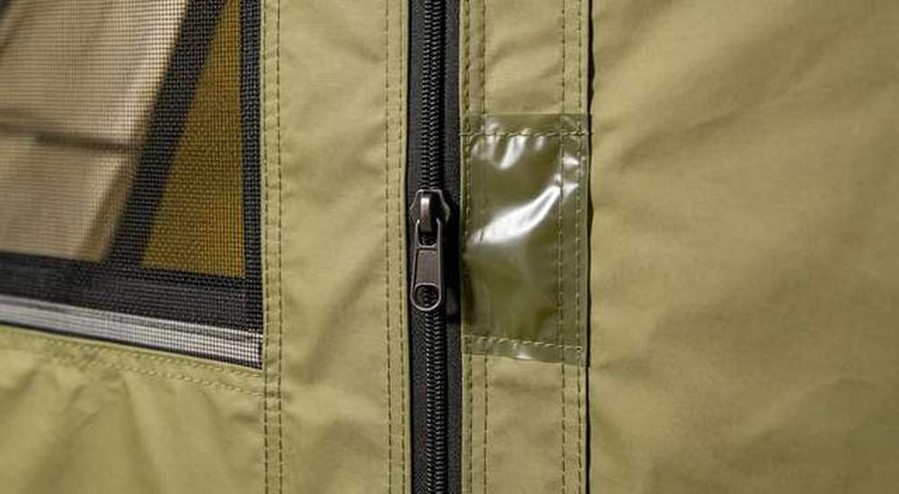 Close-up detail of emergency tent door with heavy-duty zipper and mesh window, professional OEM structural customization, professional product photography, blue sky background