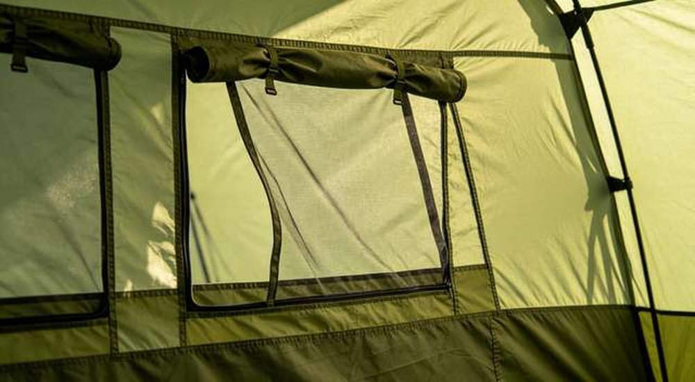 Emergency tent with mosquito netting and ventilation windows detail, custom OEM climate adapted features for tropical regions, professional product photography