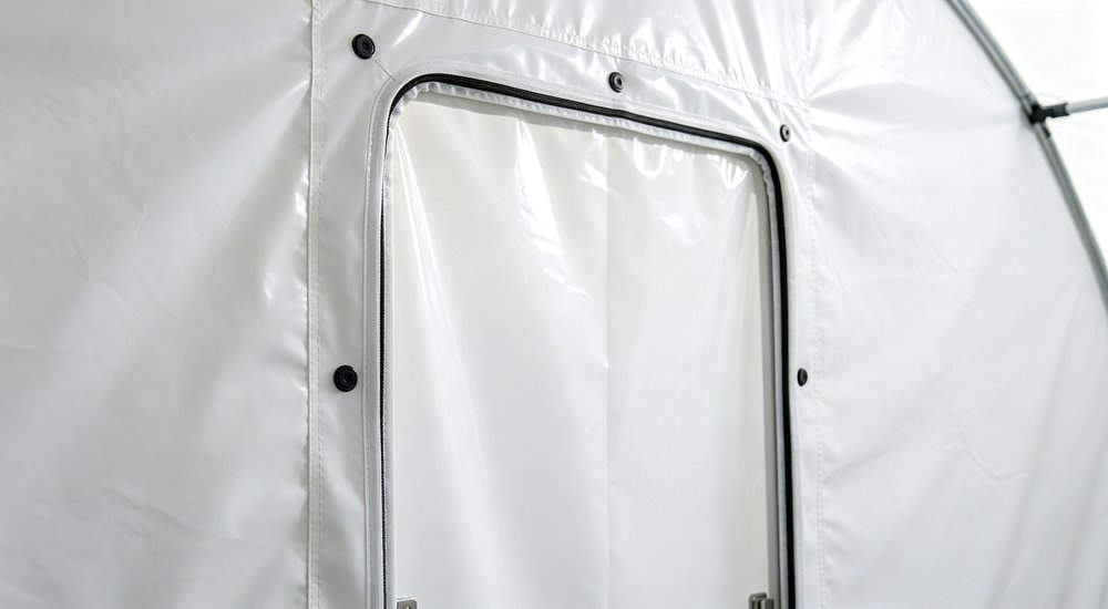 Airtight curtain inside inflatable isolation tent, fabric partition seal, bright interior red and white inflatable emergency shelter for disaster relief operations