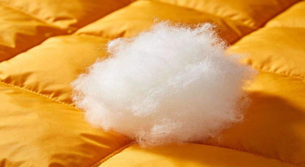 Close up of sleeping bag insulation filling material hollow fiber polyester wadding warm insulation sample