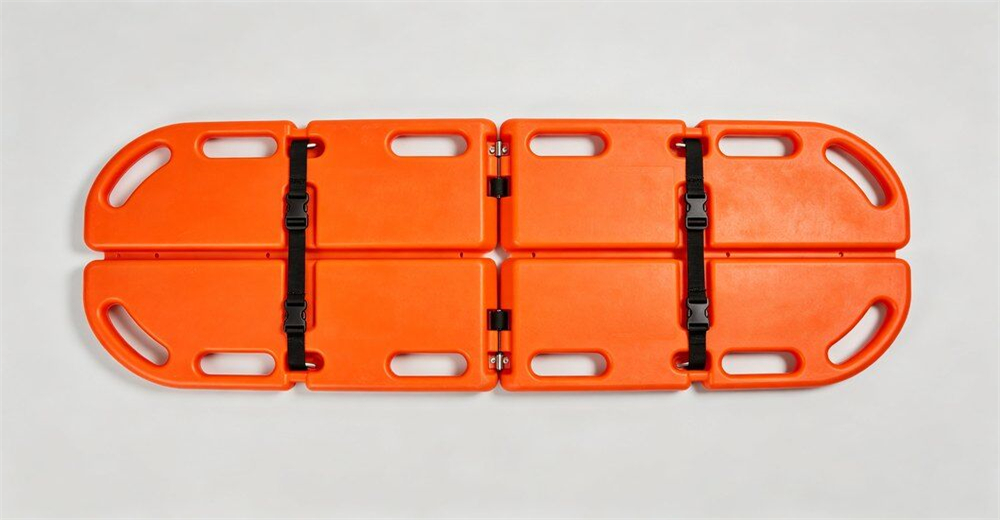 Wide angle shot of seven different types of water rescue stretchers arranged casually on bright outdoor training ground for product overview for wholesale bulk water rescue equipment supply Wide angle shot of seven different types of water rescue stretchers arranged casually on bright outdoor training ground for product overview for wholesale bulk water rescue equipment supply