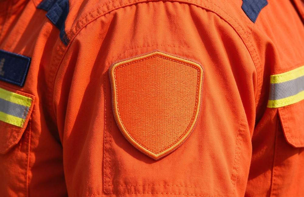 Close-up view of rescue clothing supplier checklist covering fabric and sizing for emergency rescue clothing bulk procurement by government agencies for rescue clothing wholesale buyers