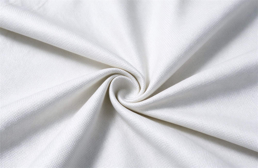 Macro shot of twisted white fiberglass woven cloth for fire blankets, rated to withstand 550°C, non-melting fire suppression textile